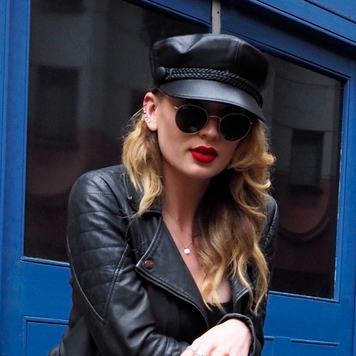 model wears john lennon leather cap